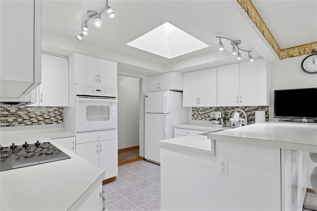 37 Coppola Road Cecil, PA 15321 - Photo 10 of 25 a kitchen with white cabinets and stainless steel appliances