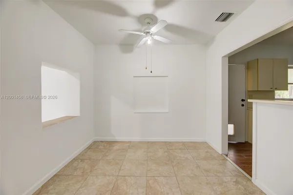 a large white kitchen with a sink