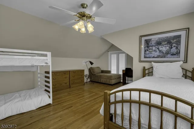 a bedroom with furniture and a chandelier