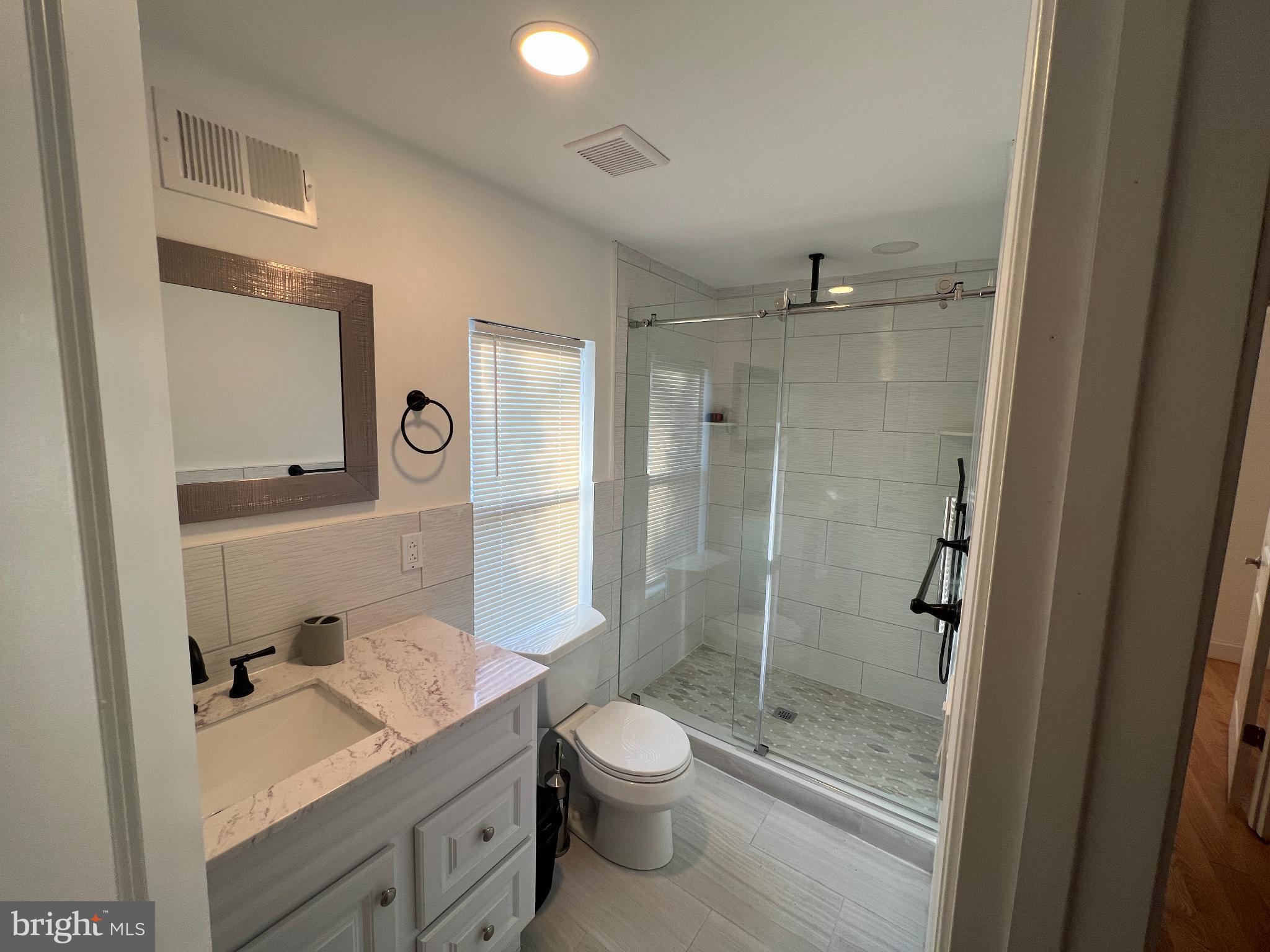 220 Lakeview Avenue Haddonfield, NJ 08033 - Photo 8 of 11 Modern bathroom with glass shower.