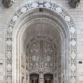 a close view of a chandelier and a fireplace in a patio