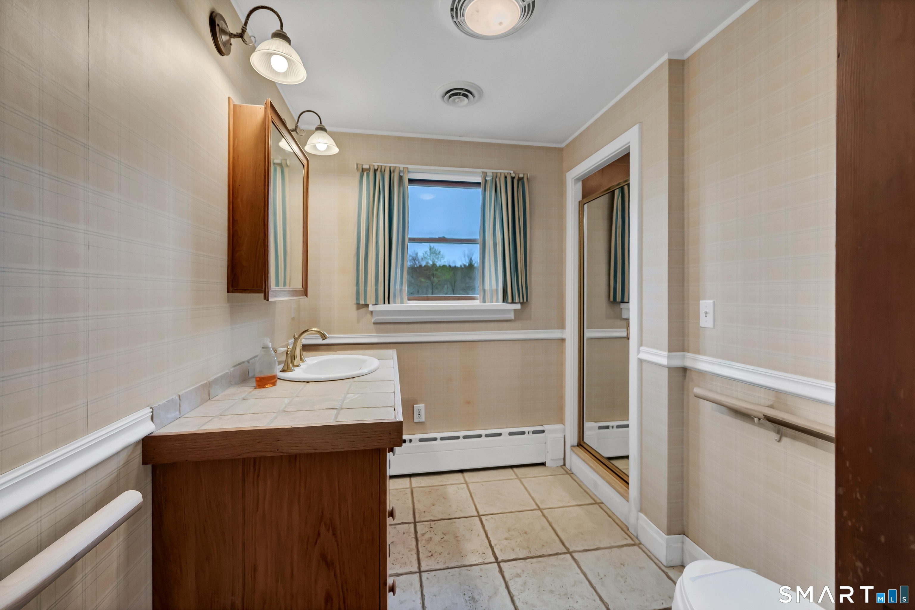 139 West Side Road Goshen, CT 06756 - Photo 12 of 17 a bathroom with a sink and a mirror