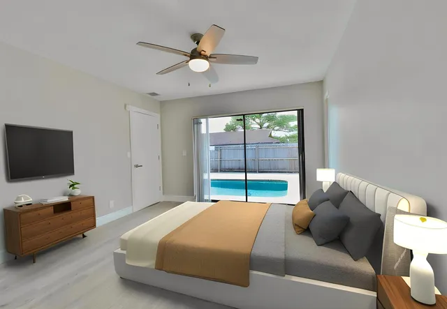 a bedroom with a bed and glass window