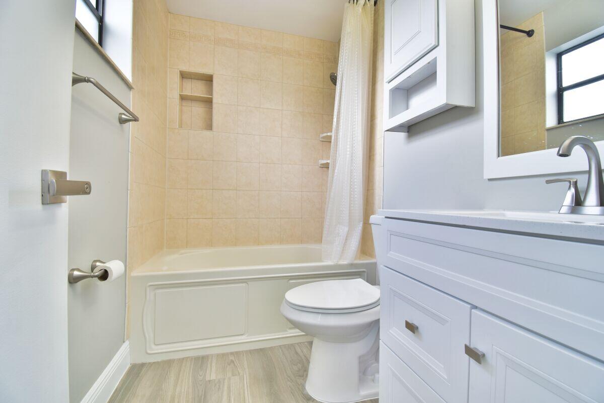 9425 Longmeadow Circle Boynton Beach, FL 33436 - Photo 18 of 34 a bathroom with a toilet and a shower