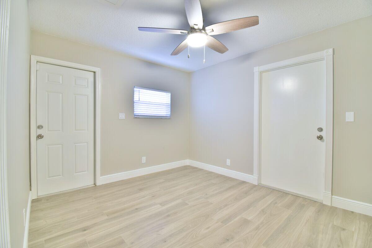 9425 Longmeadow Circle Boynton Beach, FL 33436 - Photo 26 of 34 wooden floor in an empty room