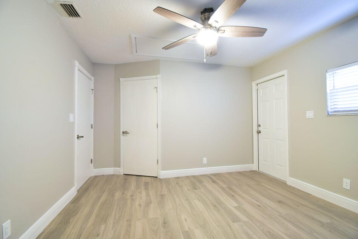 9425 Longmeadow Circle Boynton Beach, FL 33436 - Photo 27 of 34 wooden floor in an empty room with a window