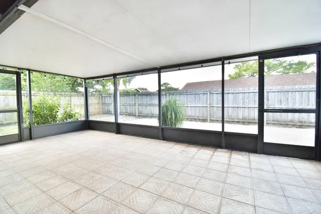 a view of an empty room with a large window