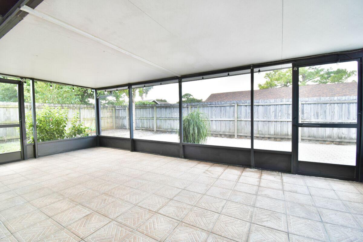9425 Longmeadow Circle Boynton Beach, FL 33436 - Photo 28 of 34 a view of an empty room with a large window
