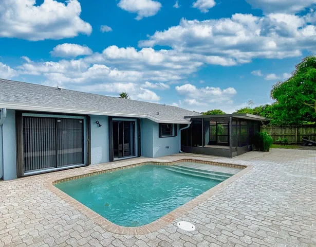 a view of a backyard of the house