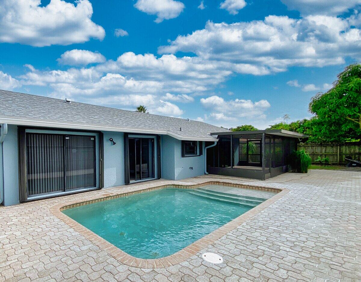 9425 Longmeadow Circle Boynton Beach, FL 33436 - Photo 32 of 34 a view of a backyard of the house