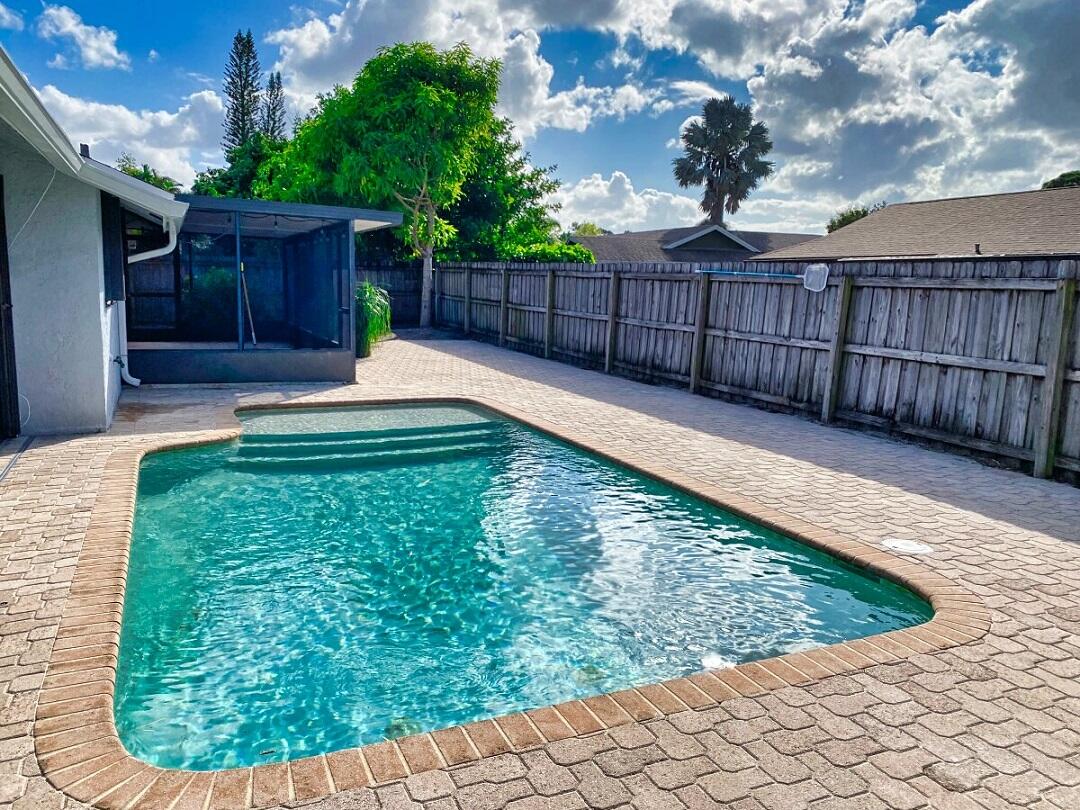 9425 Longmeadow Circle Boynton Beach, FL 33436 - Photo 34 of 34 a view of a backyard with a small cabin