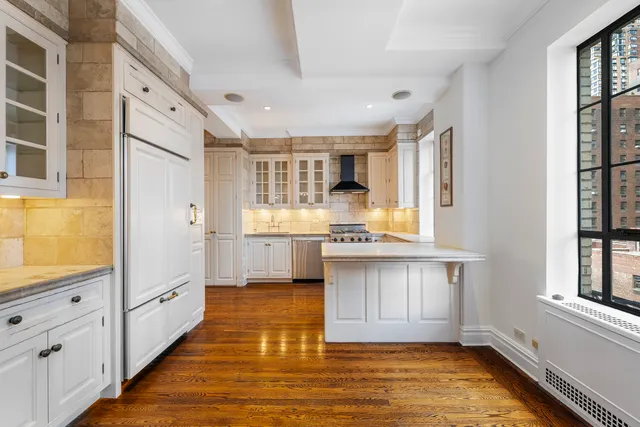 a living room with furniture and a book shelf