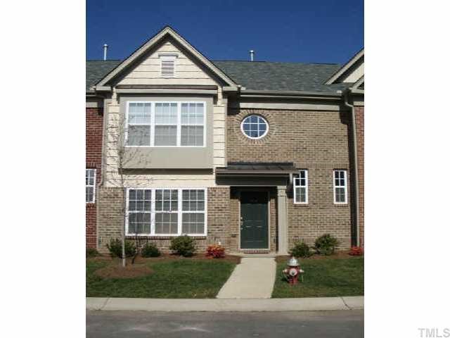 9814 Layla Avenue Raleigh, NC 27617 - Photo 1 of 7 a front view of a house with a yard