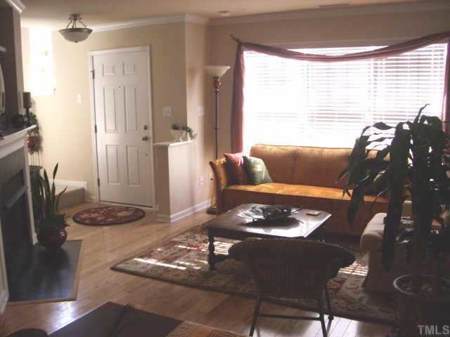 9814 Layla Avenue Raleigh, NC 27617 - Photo 3 of 7 a living room with furniture and a window