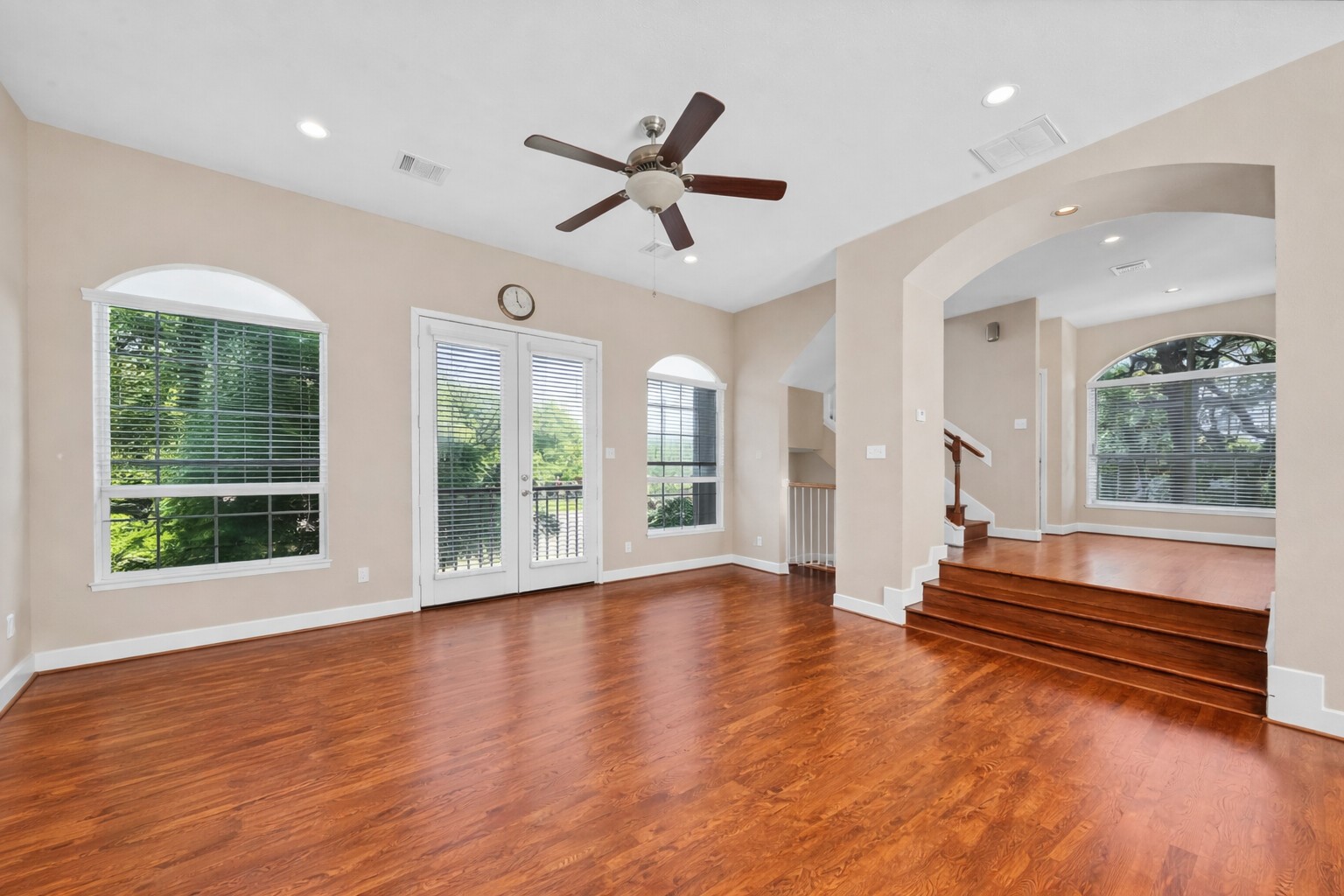 5206 Petty Street Houston, TX 77007 - Photo 11 of 26 a view of an empty room with wooden floor and a window