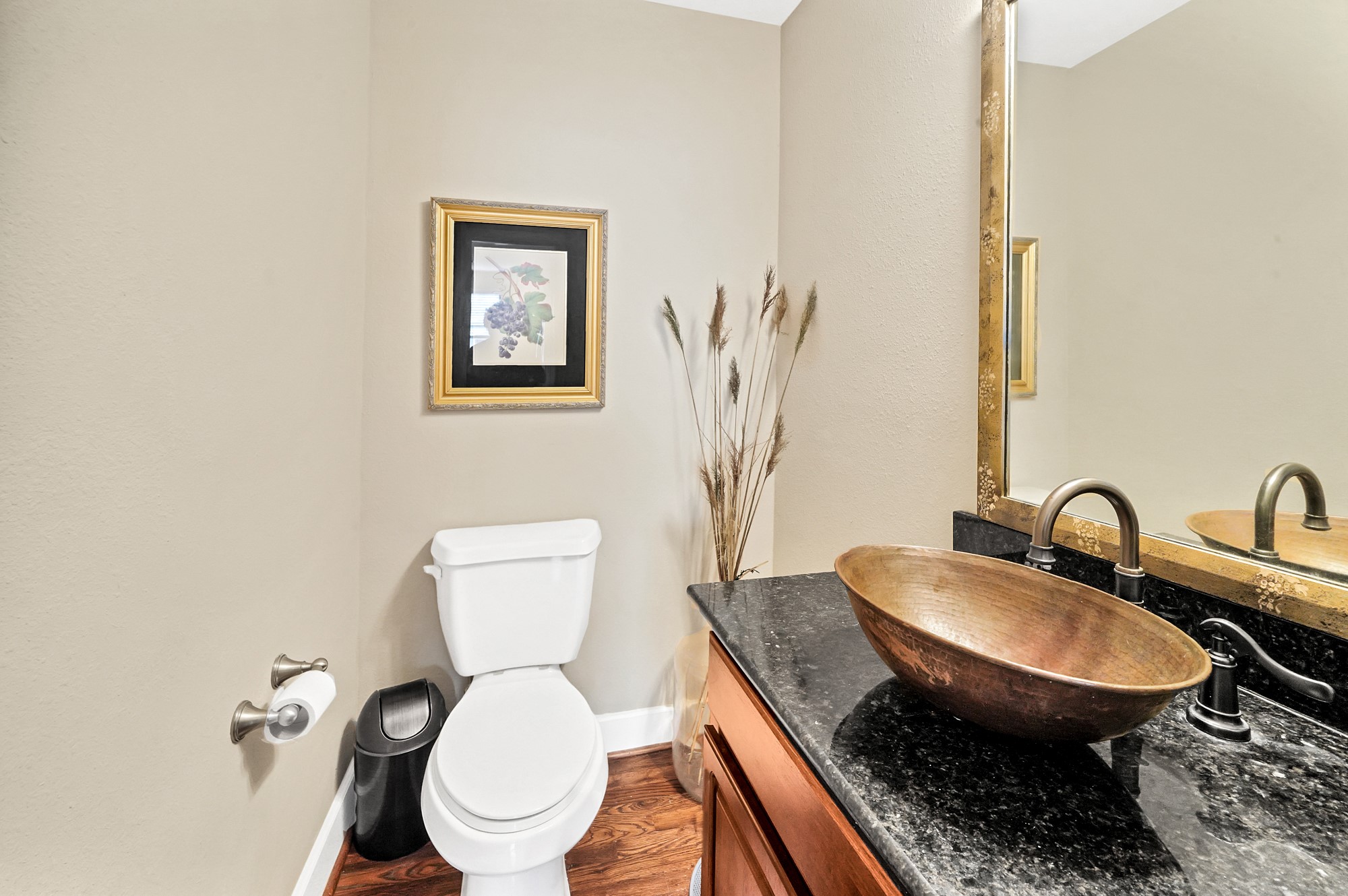 5206 Petty Street Houston, TX 77007 - Photo 13 of 26 a bathroom with a toilet and a sink