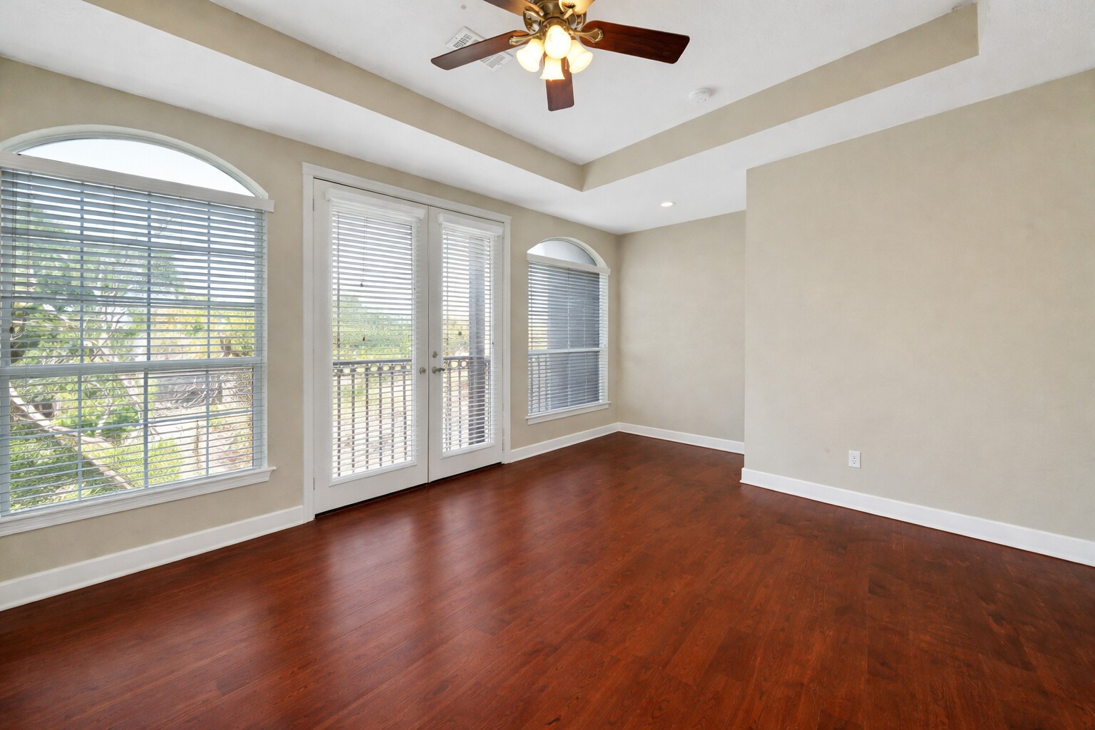 5206 Petty Street Houston, TX 77007 - Photo 15 of 26 a view of an empty room with wooden floor and a window