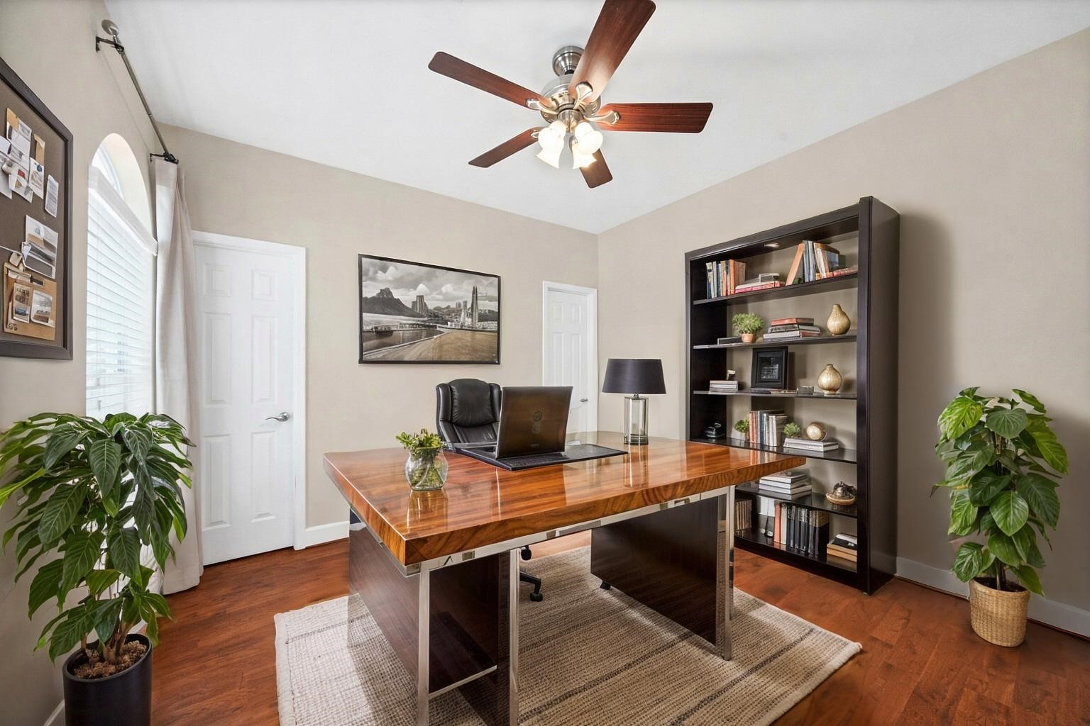 5206 Petty Street Houston, TX 77007 - Photo 5 of 26 a view of a workspace with furniture and wooden floor