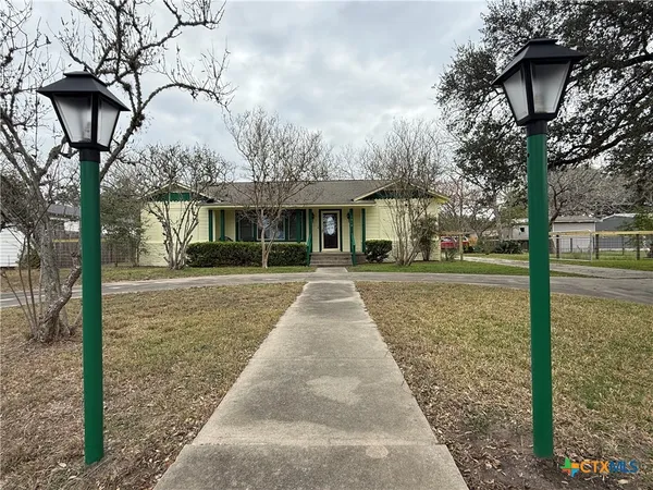 a view of house with yard