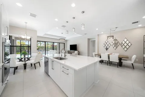 a large room with a large window and furniture