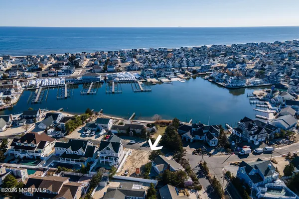 an aerial view of a house with a lake view