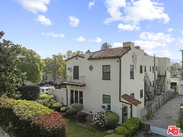 a view of a house with a garden