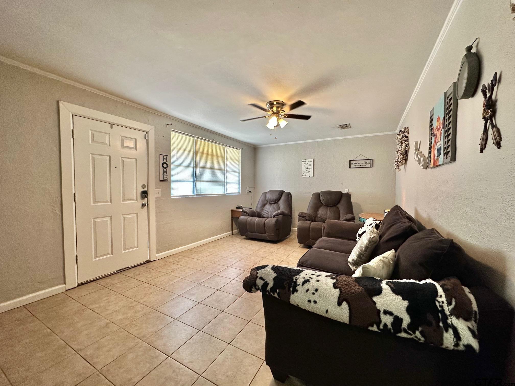 2601 East George Richey Road Longview, TX 75604 - Photo 10 of 26 a living room with furniture chess board and a window