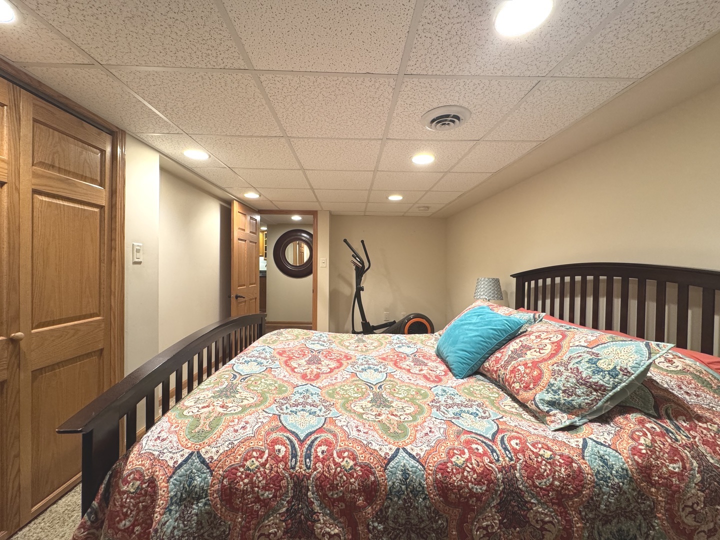 2041 Bluff Road South Kankakee, IL 60901 - Photo 29 of 39 a bedroom with a large bed and a chandelier