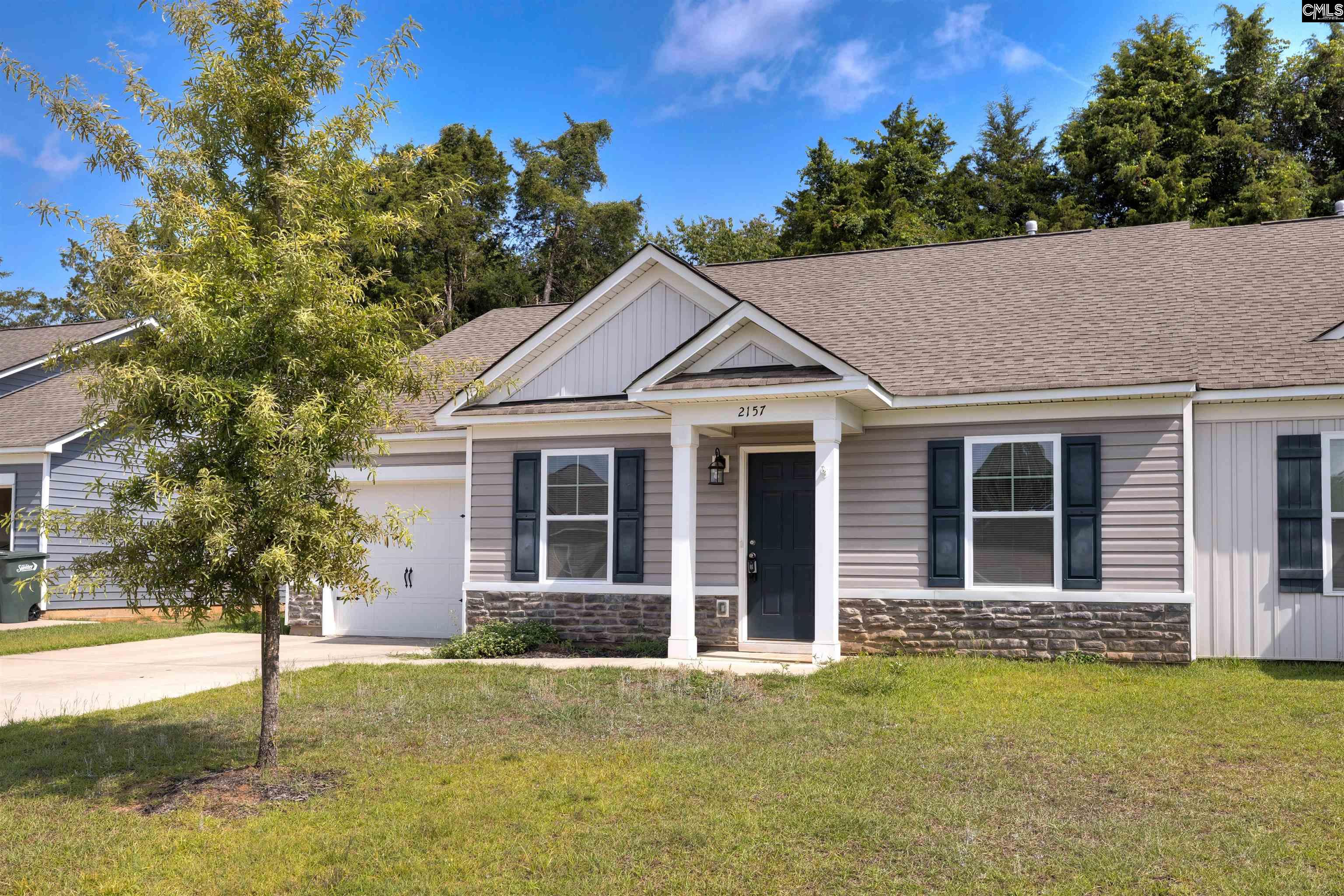 2157 Still Pointe Drive Sumter, SC 29154 - Photo 2 of 25 a front view of a house with a garden
