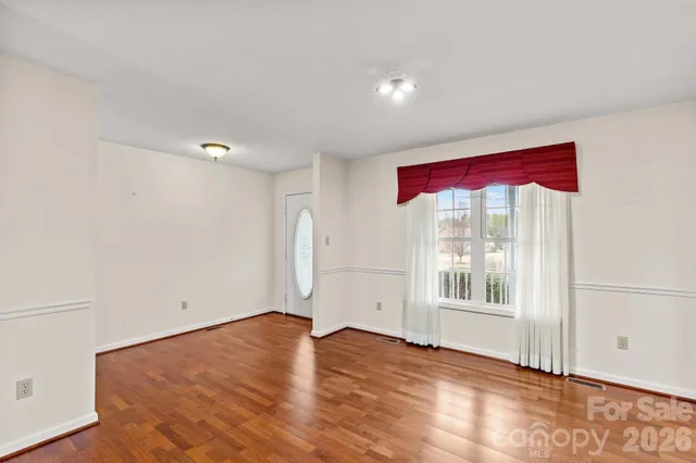 a kitchen with stainless steel appliances granite countertop a refrigerator a stove a sink a microwave and cabinets