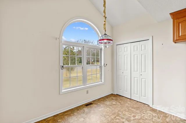 a view of a kitchen with a sink and cabinets