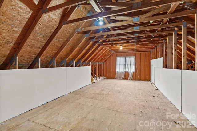 a view of balcony with wooden floor and fence