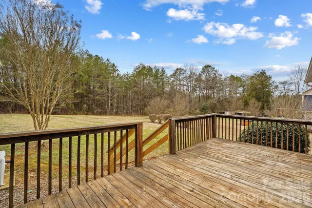 a view of a patio with table and chairs