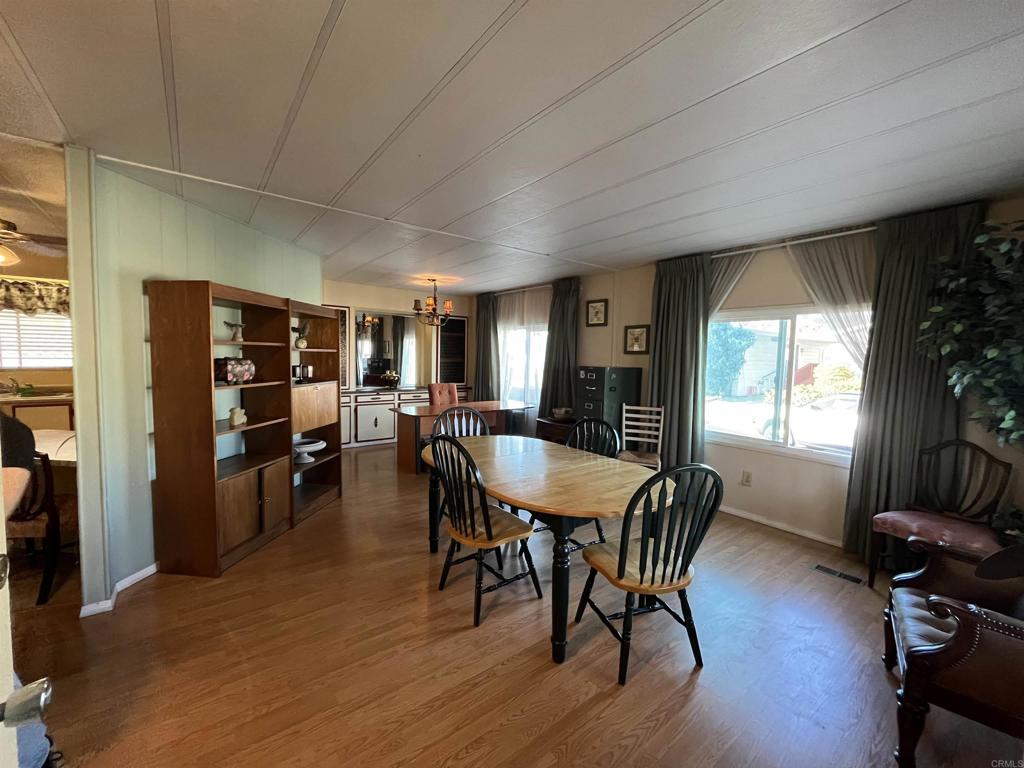 1810 Hillsdale Road, Unit 99 El Cajon, CA 92019 - Photo 8 of 15 a dining room with furniture window and wooden floor