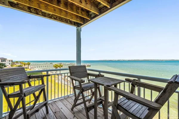 a view of a balcony with an ocean view