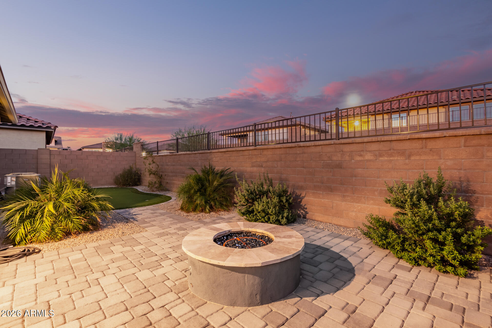 8835 South 166th Avenue Goodyear, AZ 85338 - Photo 13 of 23 a view of a terrace with a chair and potted plants