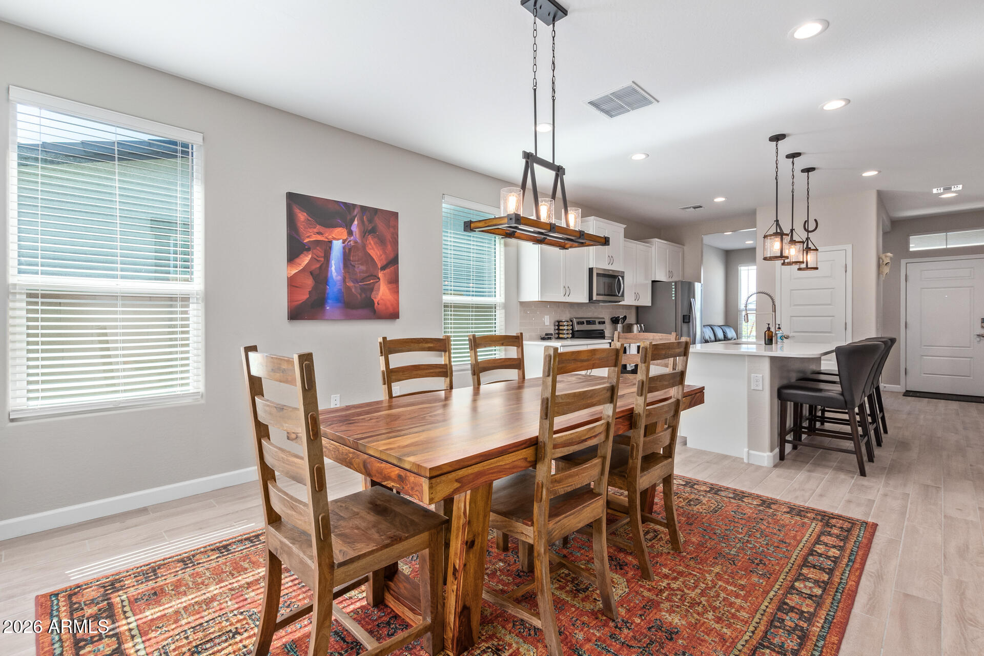 8835 South 166th Avenue Goodyear, AZ 85338 - Photo 2 of 23 a view of a dining room with furniture
