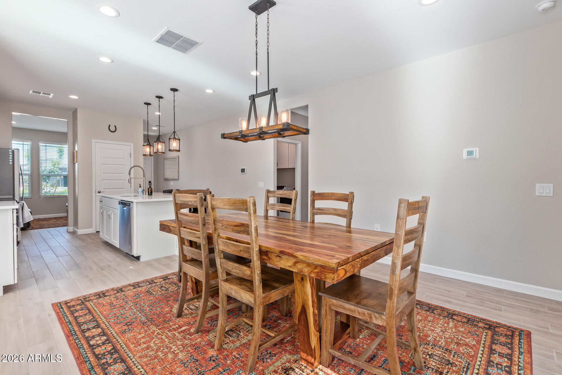 8835 South 166th Avenue Goodyear, AZ 85338 - Photo 21 of 23 a view of a dining room with furniture