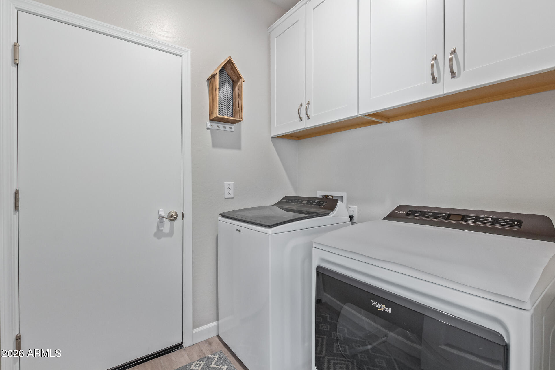 8835 South 166th Avenue Goodyear, AZ 85338 - Photo 9 of 23 a utility room with dryer and washer
