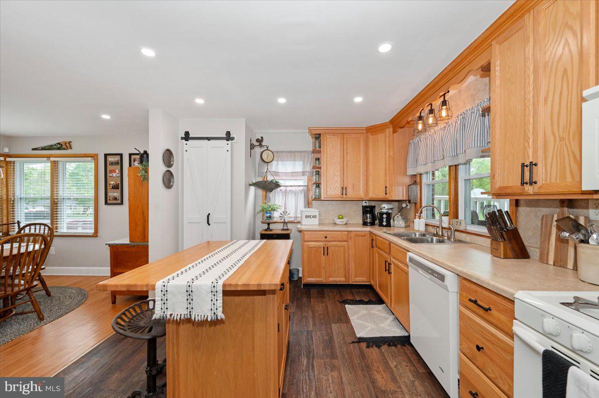 7117 Blue Mountain Road Thurmont, MD 21788 - Photo 20 of 80 a large kitchen with stainless steel appliances lots of counter space and windows