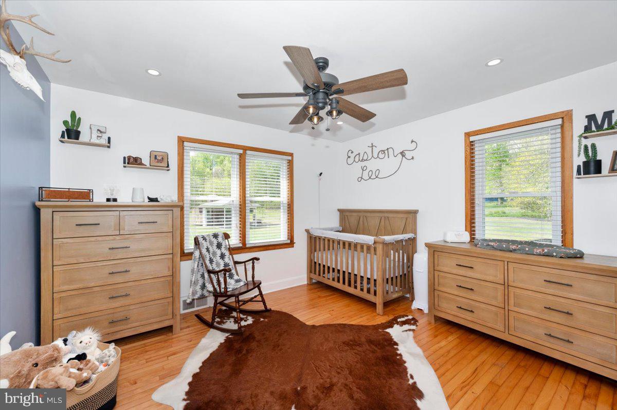 7117 Blue Mountain Road Thurmont, MD 21788 - Photo 23 of 80 a bedroom with a bed and a window