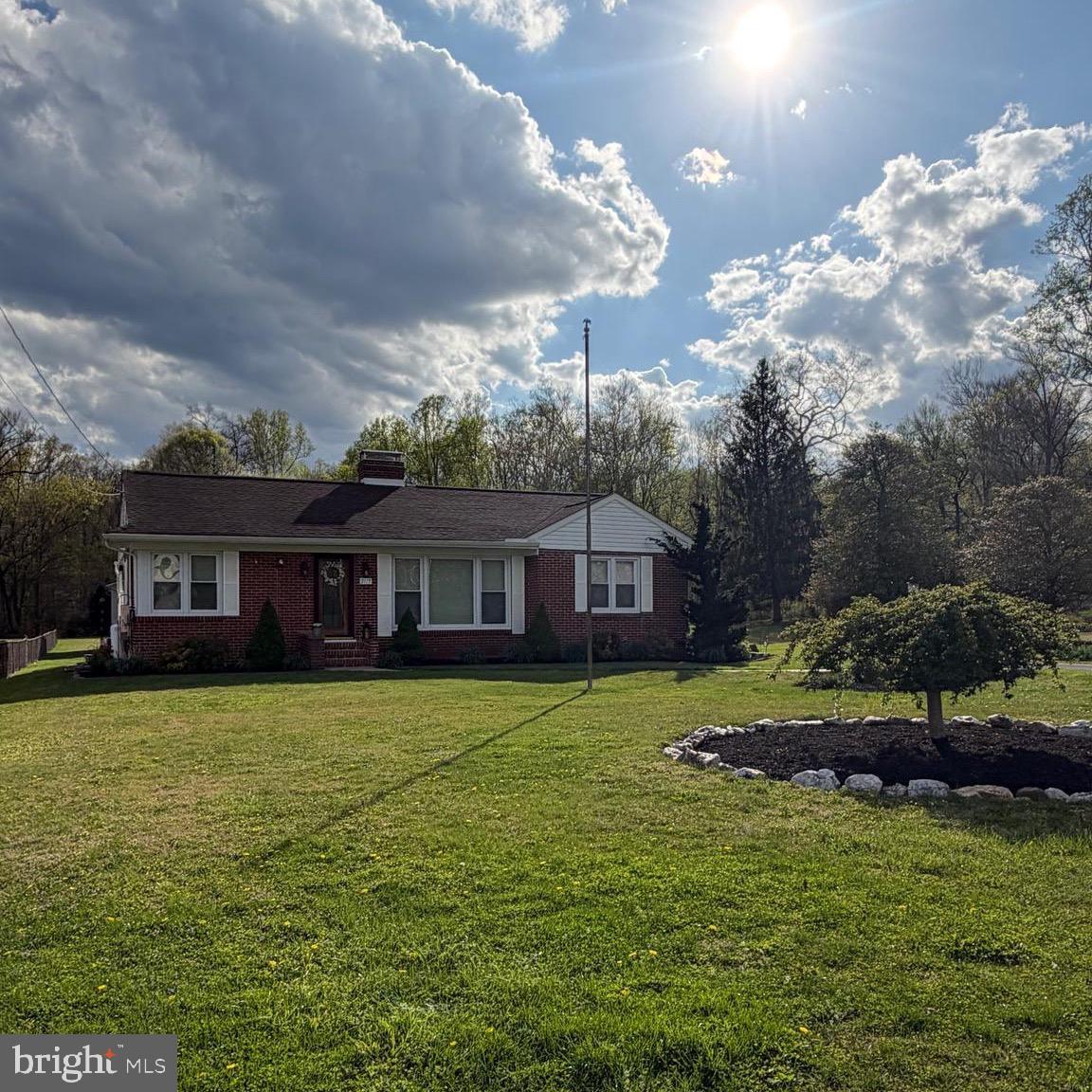 7117 Blue Mountain Road Thurmont, MD 21788 - Photo 4 of 80 a view of a house with a big yard and potted plants