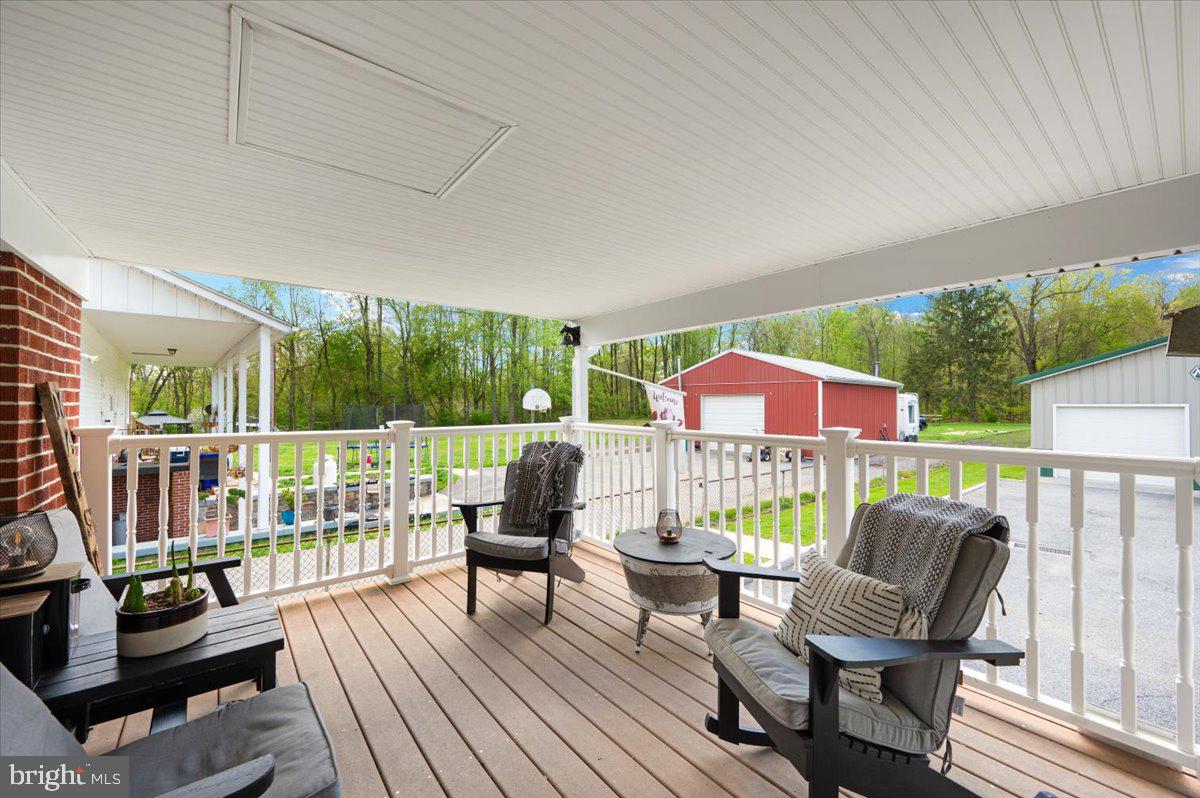7117 Blue Mountain Road Thurmont, MD 21788 - Photo 43 of 80 a balcony with furniture and garden view