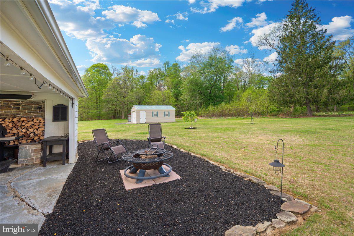 7117 Blue Mountain Road Thurmont, MD 21788 - Photo 47 of 80 a view of a backyard with table and chairs