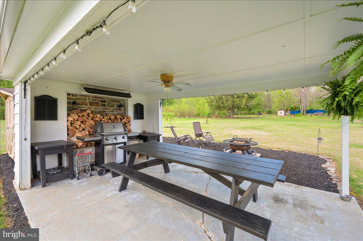 7117 Blue Mountain Road Thurmont, MD 21788 - Photo 49 of 80 a view of a swimming pool with chairs and tables