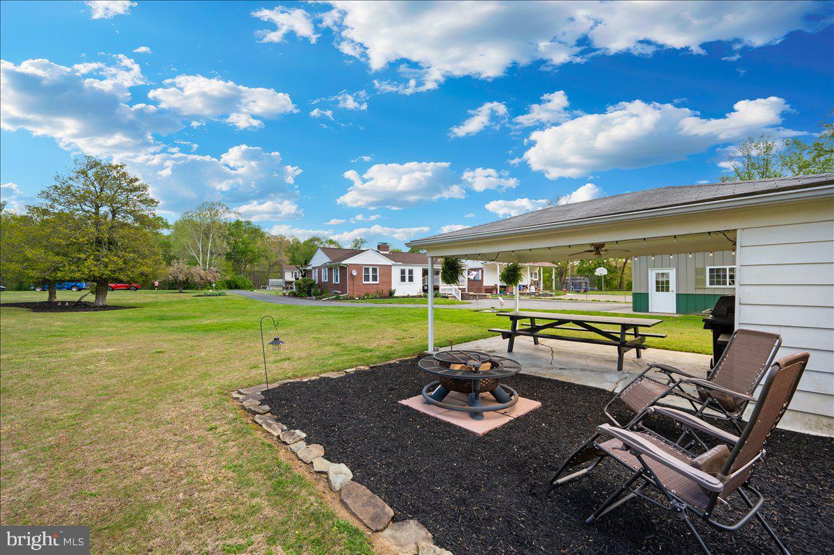 7117 Blue Mountain Road Thurmont, MD 21788 - Photo 50 of 80 a view of a swimming pool with lawn chairs and a yard