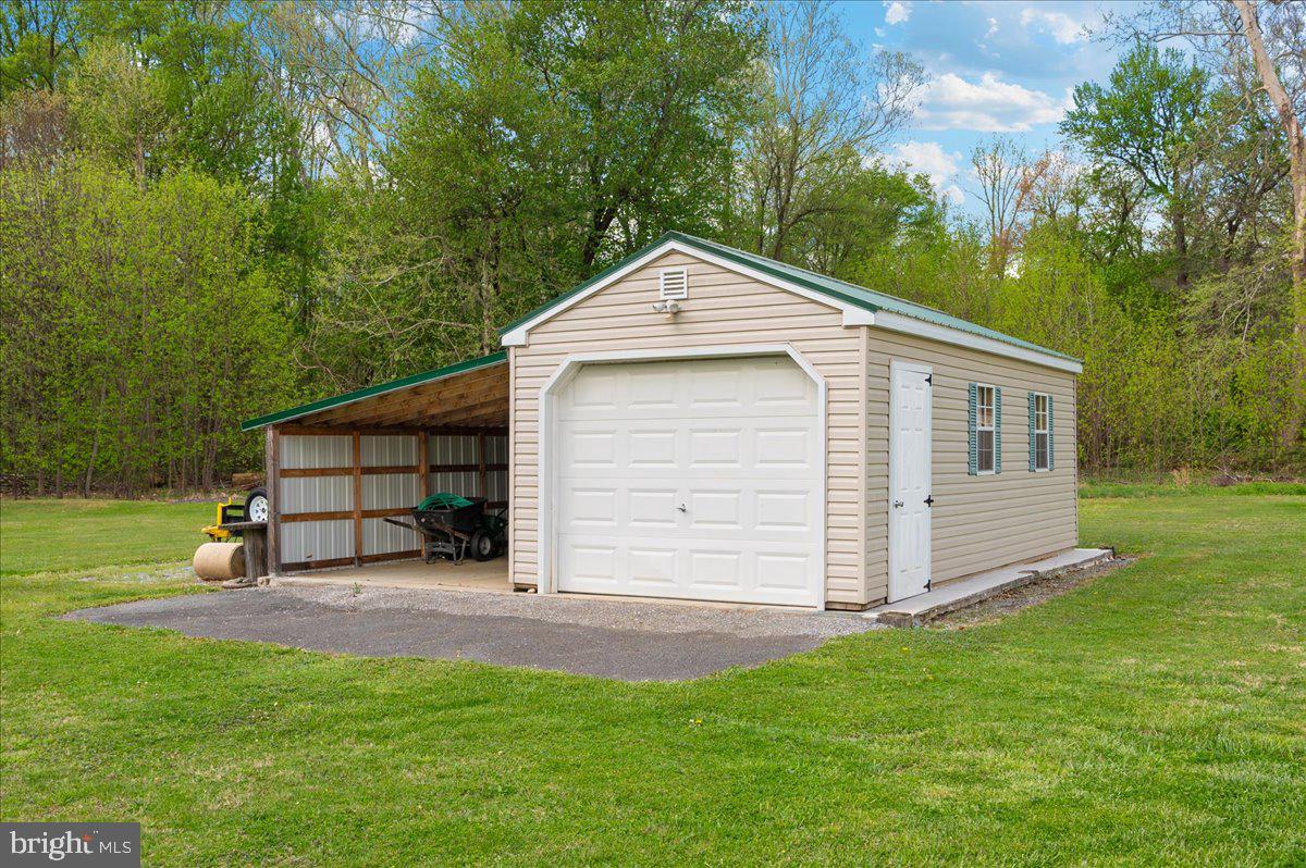 7117 Blue Mountain Road Thurmont, MD 21788 - Photo 56 of 80 a front view of a house with a yard and garage