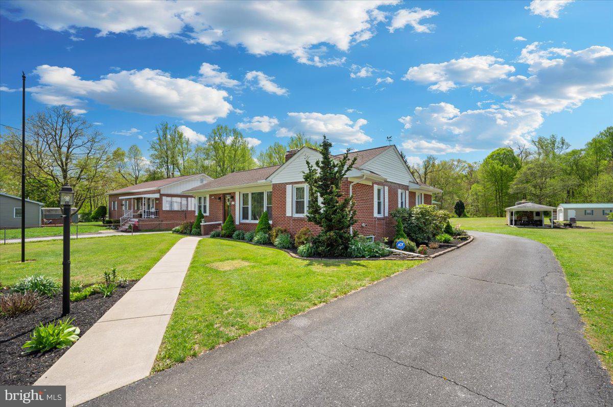 7117 Blue Mountain Road Thurmont, MD 21788 - Photo 69 of 80 a front view of a house with a yard