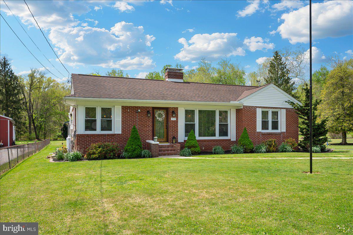 7117 Blue Mountain Road Thurmont, MD 21788 - Photo 76 of 80 a front view of a house with a yard and trees