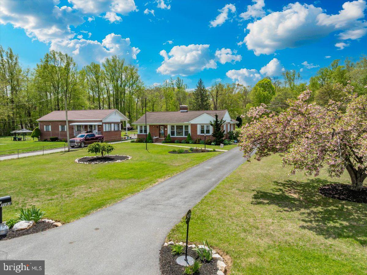 7117 Blue Mountain Road Thurmont, MD 21788 - Photo 78 of 80 a view of swimming pool with outdoor seating and trees